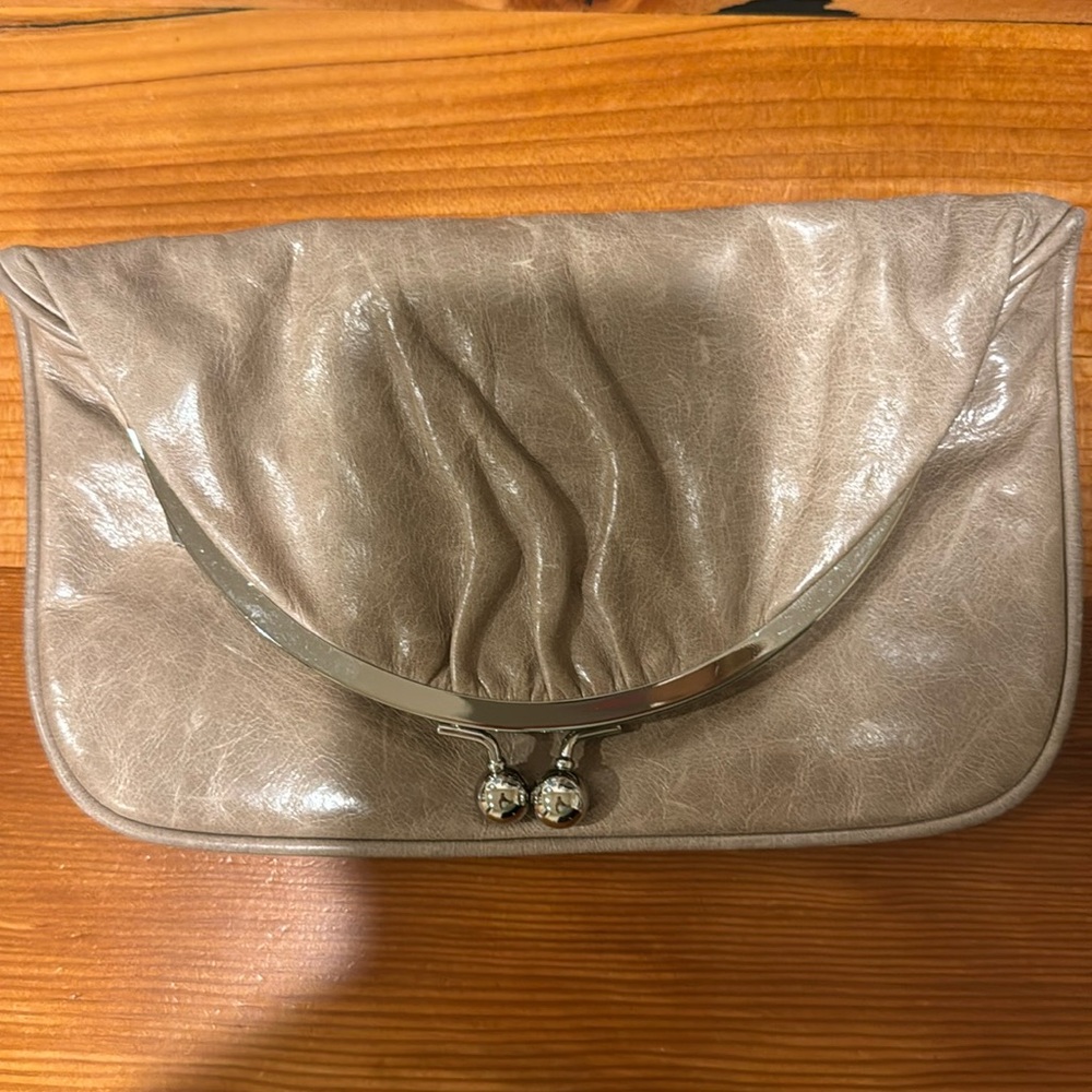 Genuine Hobo clutch with magnetic closure.